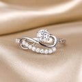 White Gold Infinity Swirl Moissanite Ring